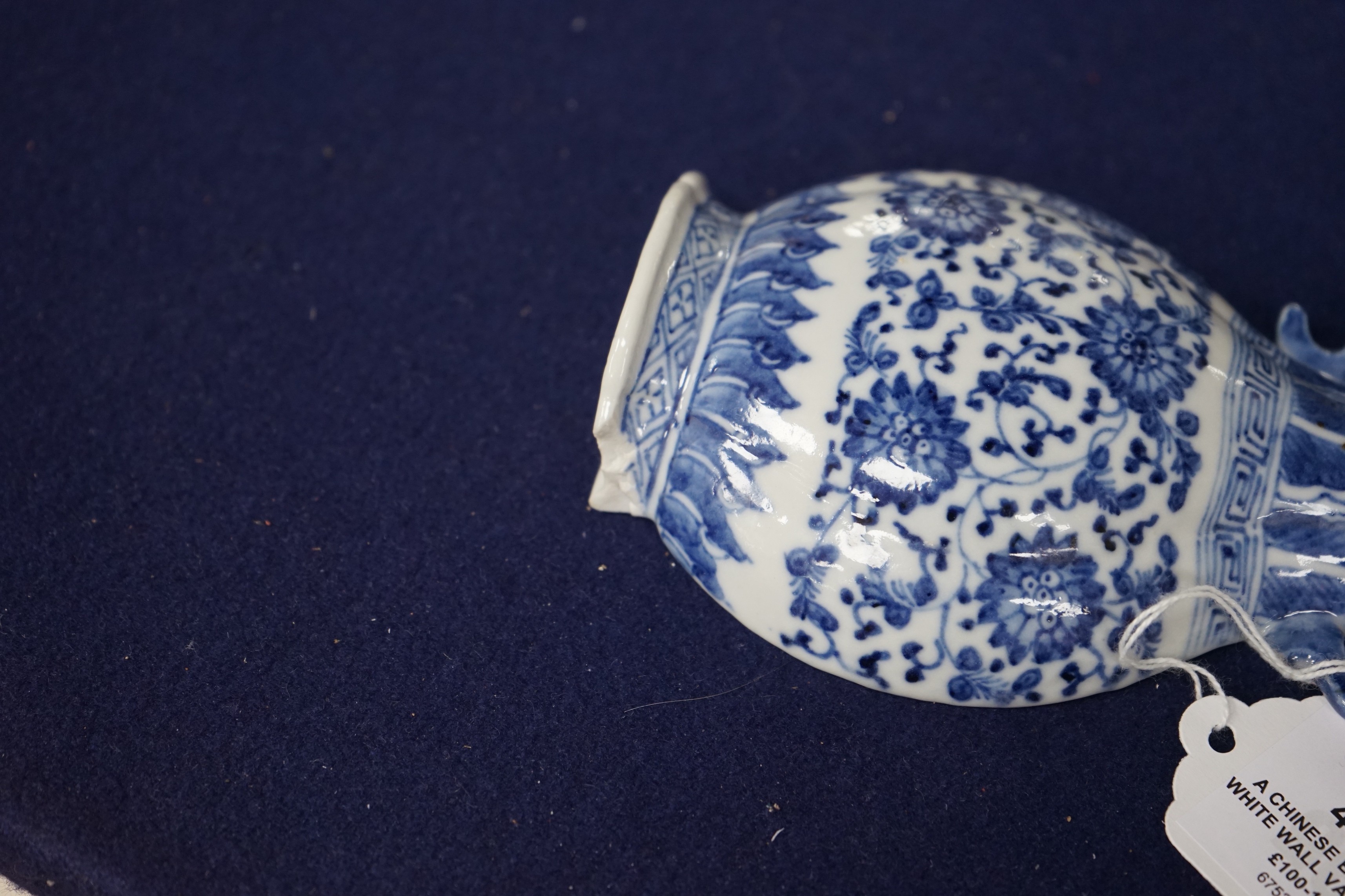 A Chinese blue and white wall vase shaped pocket, 19th century, 16.5cm tall